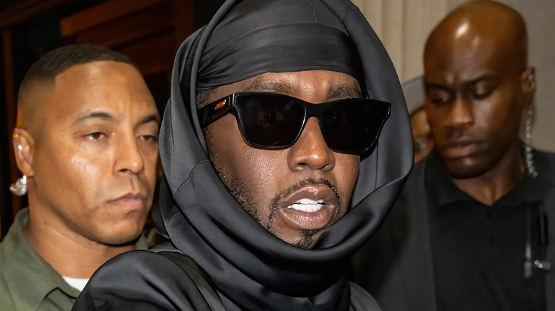 Diddy looking shocked with sunglasses on
