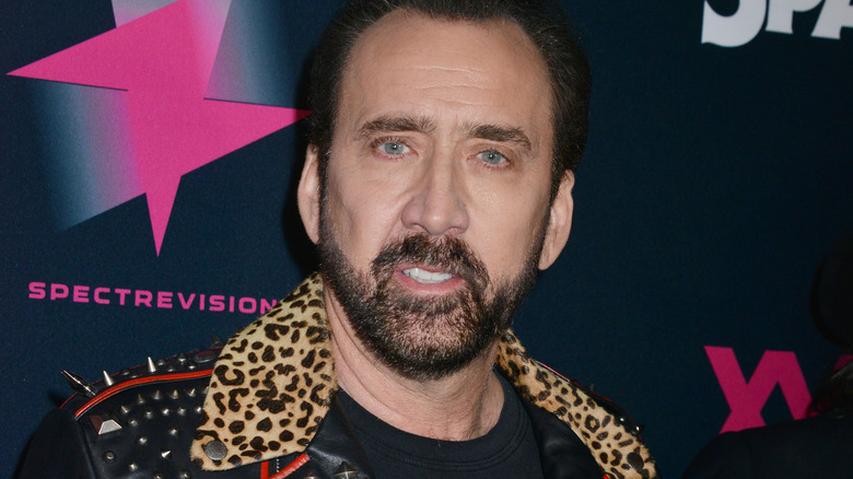 Nicolas Cage smiling leopard print