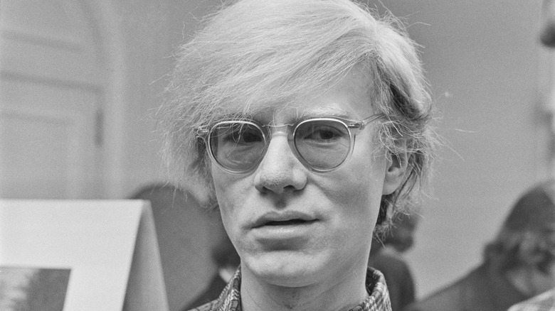 Andy Warhol wearing glasses
