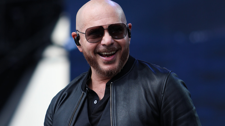 Pitbull wearing sunglasses and smiling