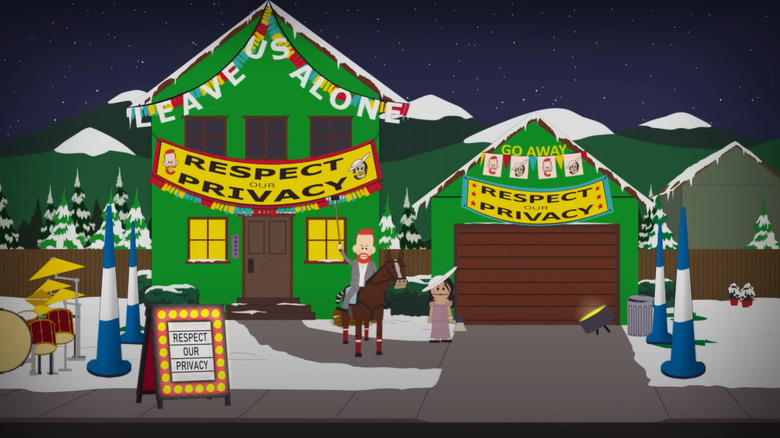 Meghan Markle and Prince Harry with "Respect our Privacy" signs on South Park