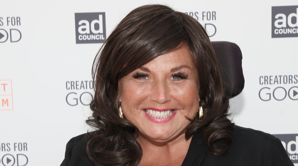 Abby Lee Miller smiling at the camera