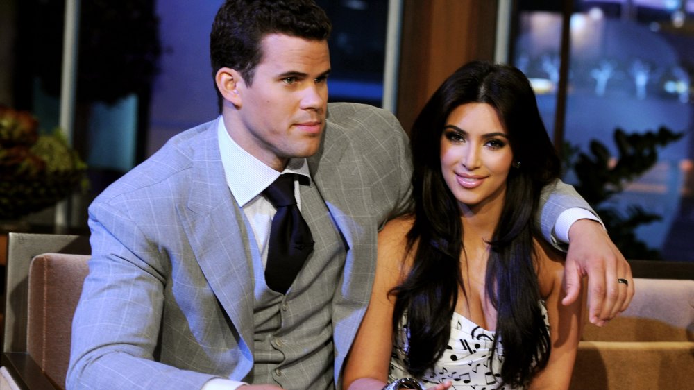 Kris Humphries and Kim Kardashian sitting next to each other on a late night talk show