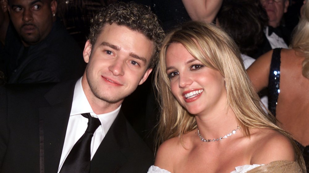 Justin Timberlake and Britney Spears sitting next to each other smiling