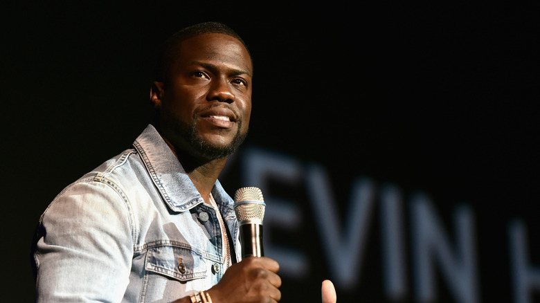 Kevin Hart holding a microphone