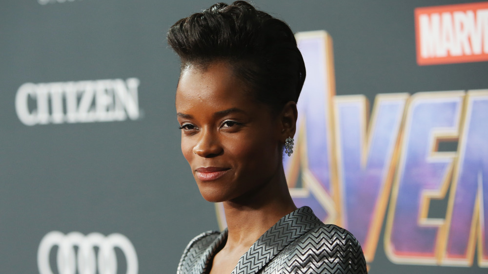 Letitia Wright smirking 