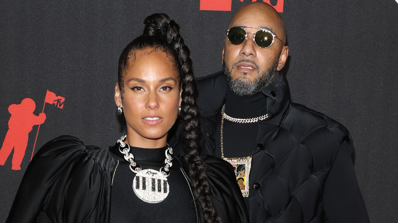 Swizz Beats posing with Alicia Keys