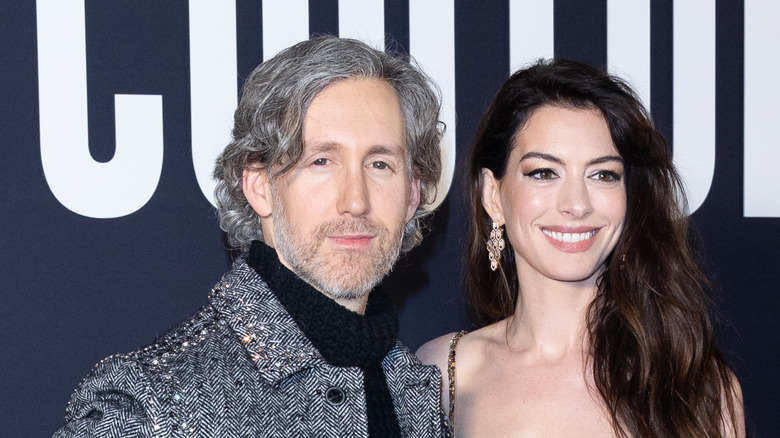 Adam Shulman posing with Anne Hathaway