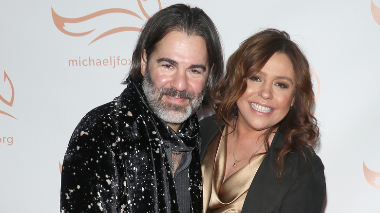 Rachael Ray and John Cusimano embracing on a red carpet