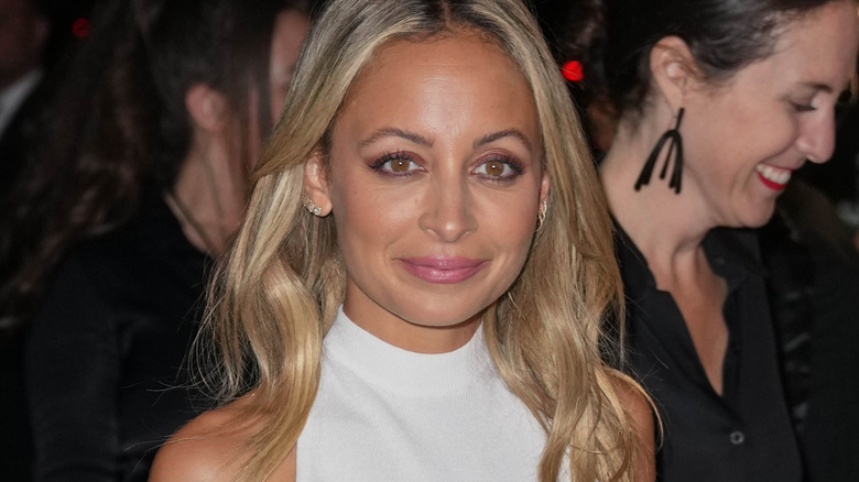 Nicole Richie smiling in white gown