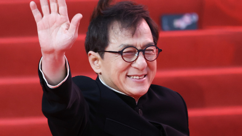 Jackie Chan smiling and waving