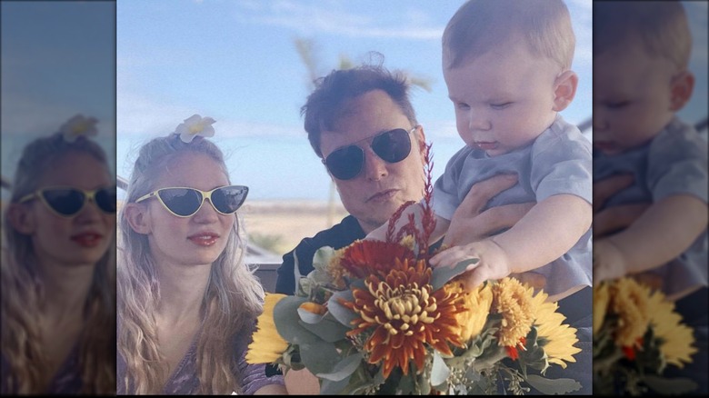 Grimes and Elon Musk with their son, X
