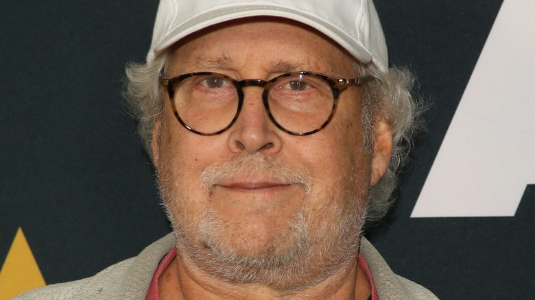 Chevy Chase staring into camera