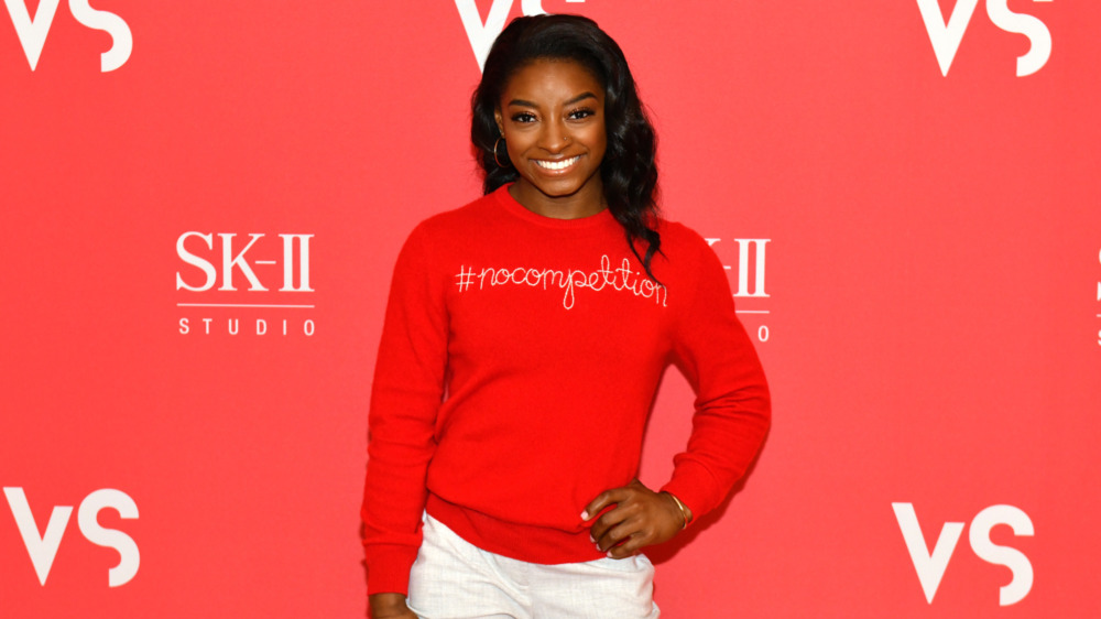 Simone Biles smiling red carpet