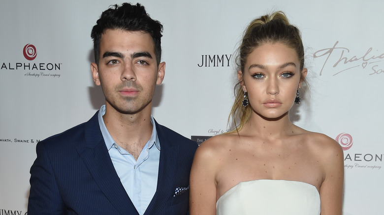 Joe Jonas, Gigi Hadid with blank expressions