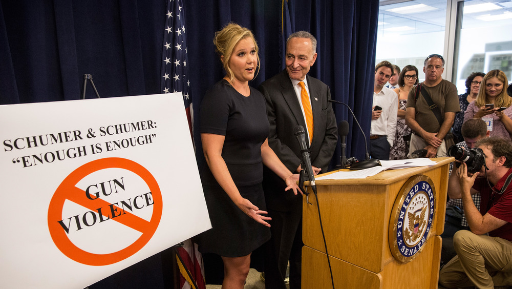 Amy Schumer and Chuck Schumer at an event on gun violence