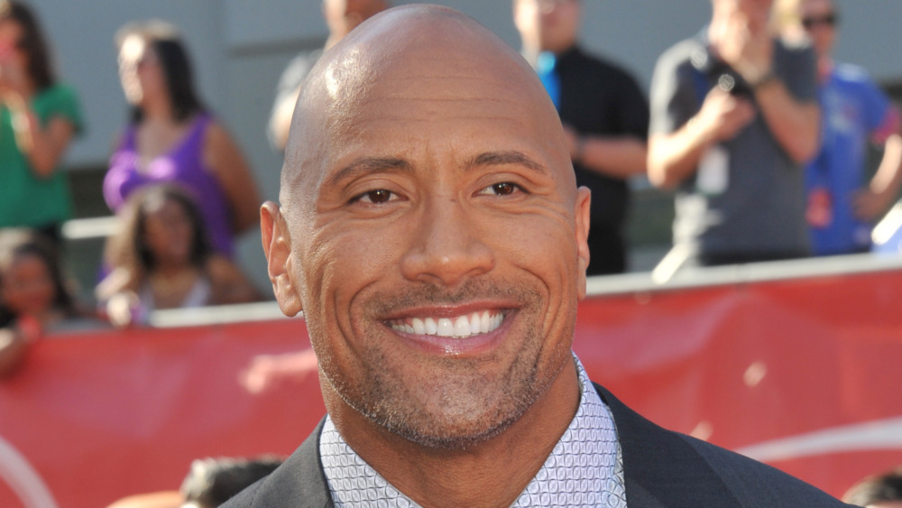 Dwayne Johnson suit smiling