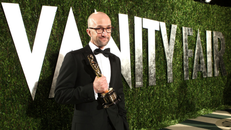 Jim Rash posing with his Oscar