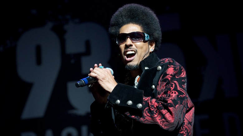 Shock G performing holding microphone