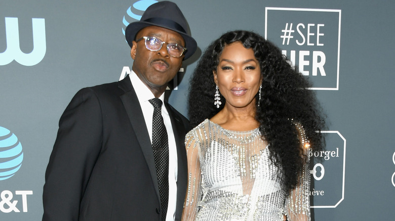 Courtney B. Vance and Angela Bassett smiling on red carpet