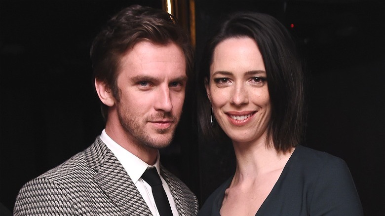 Dan Stevens and Rebecca Hall smiling at camera