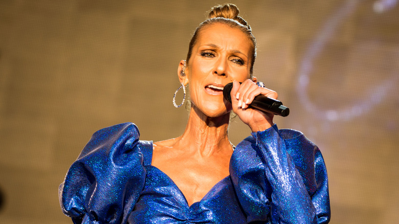 celine dion singing in a blue dress