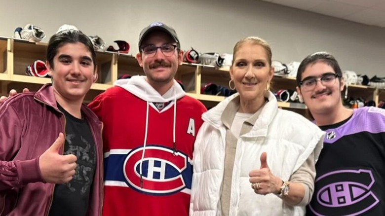 Eddy, Nelson, and Rene-Charles Angelil pose with Celine Dion