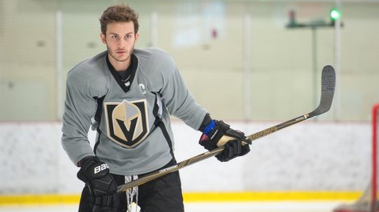 Rene-Charles Angelil playing hockey