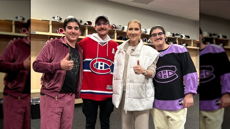 Celine Dion and her sons at a hockey game