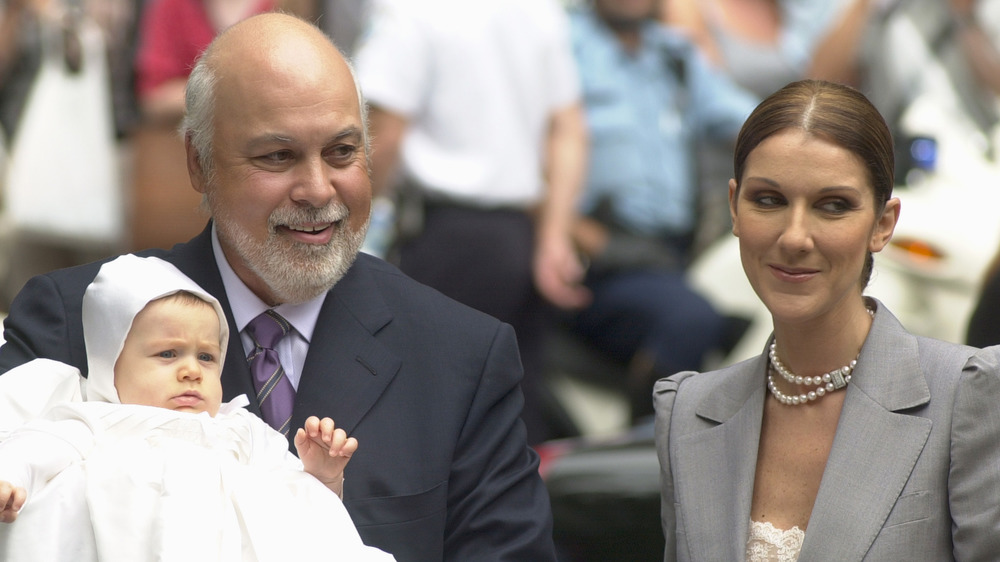 Celine Dion, René Angélil, and René-Charles Angélil smiling at the chapel