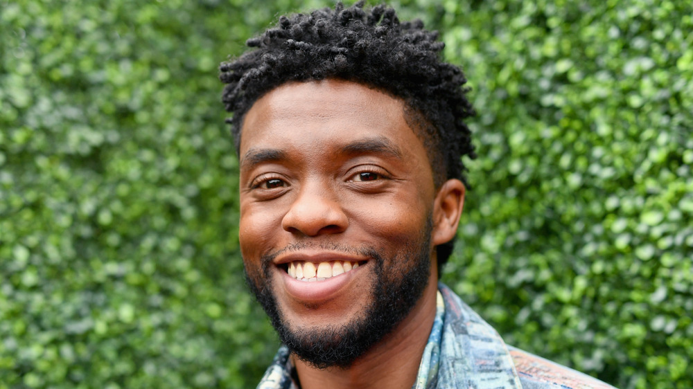 Chadwick Boseman smiling at an event