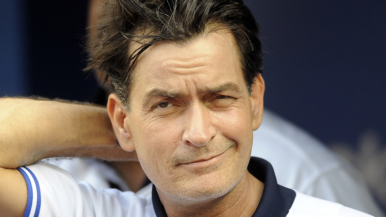 Charlie Sheen smirks