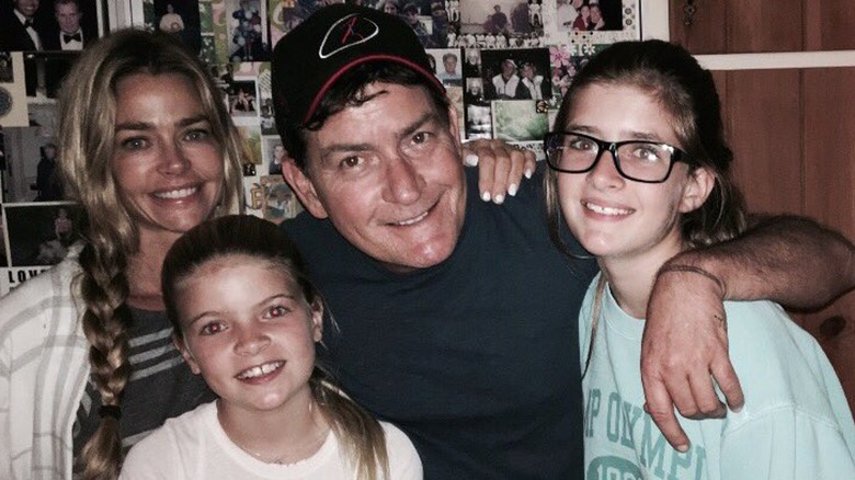 Denise Richards, Charlie Sheen posing with daughters