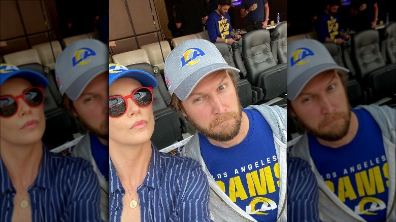 Charlize Theron and her friend's husband at the stadium