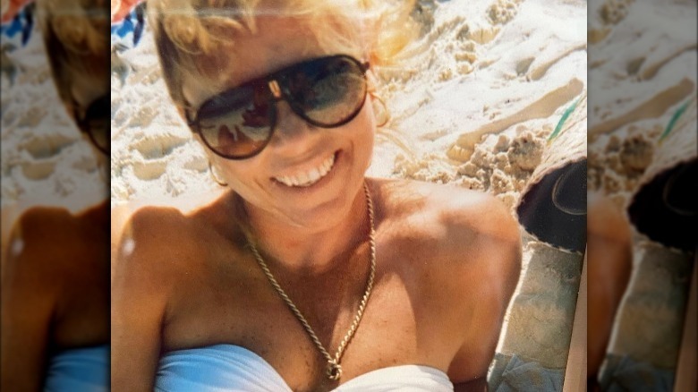 Charlize Theron's mother wearing sunglasses