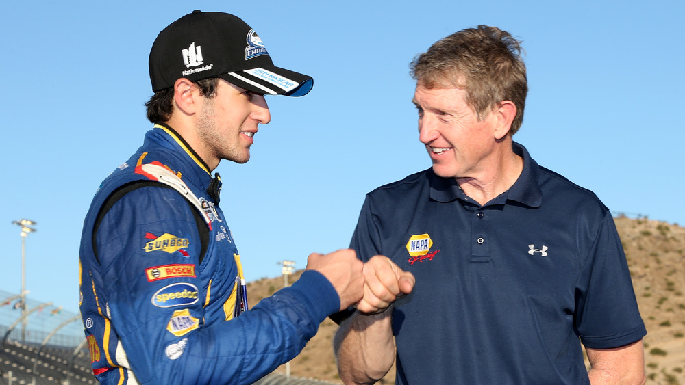 Chase Elliott giving his dad a fist bump