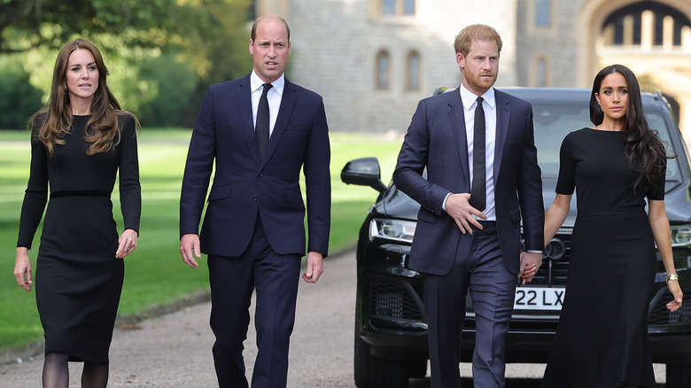 Kate Middleton, Prince William, Prince Harry, and Meghan Markle walking