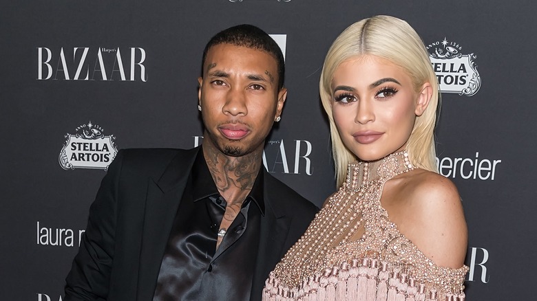 Tyga and Kylie Jenner smirking 