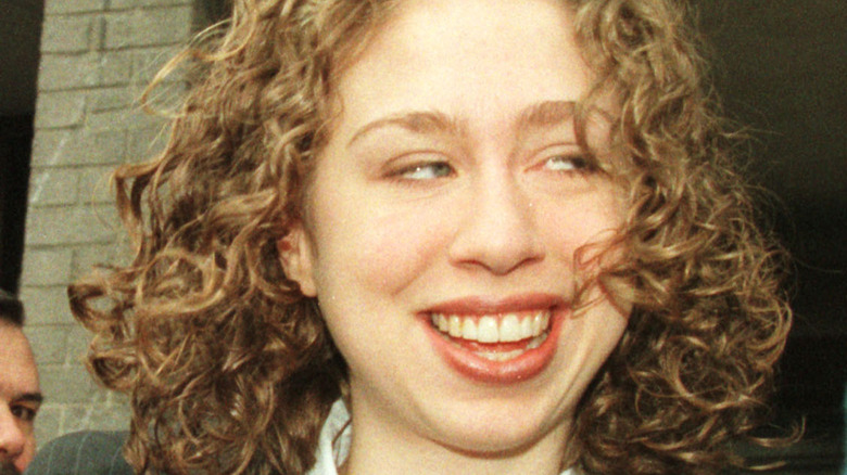 Chelsea Clinton smiling long red curly hair