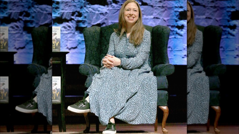 Chelsea Clinton sitting in chair