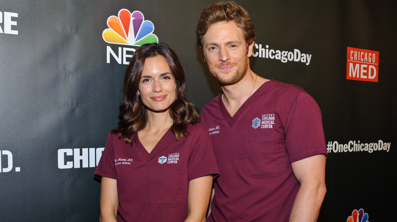 Torrey DeVitto and Nick Gehlfuss red scrubs