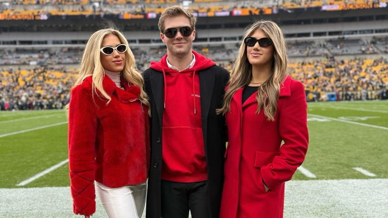 Gracie, Ava, and Knobel Hunt wearing red on field at Arrowhead Stadium