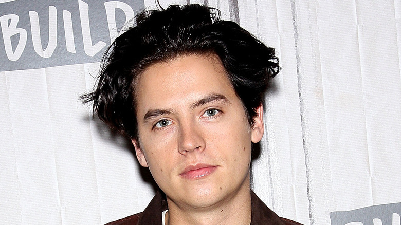 Cole Sprouse with serious expression