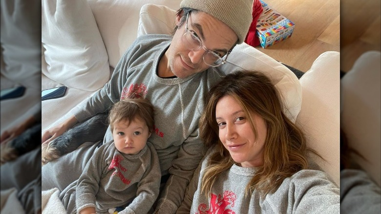 Ashley Tisdale taking selfie with husband, daughter