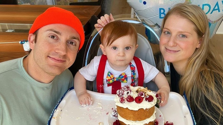 Daryl Sabara, Meghan Trainor posing with son