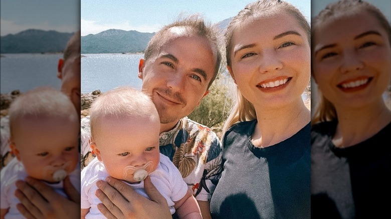 Frankie Muniz outdoors with wife and son