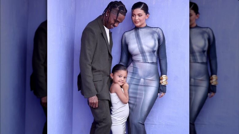 Travis Scott, Kylie Jenner posing with Stormi