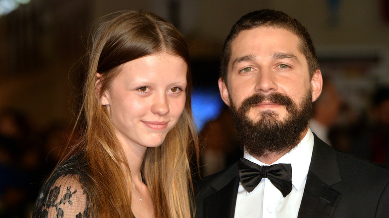 Mia Goth, Shia LaBeouf smiling