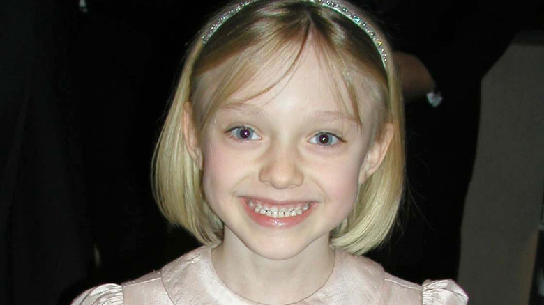 Young Dakota Fanning grinning