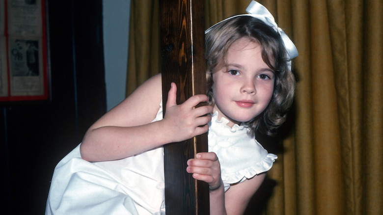 Young Drew Barrymore posing